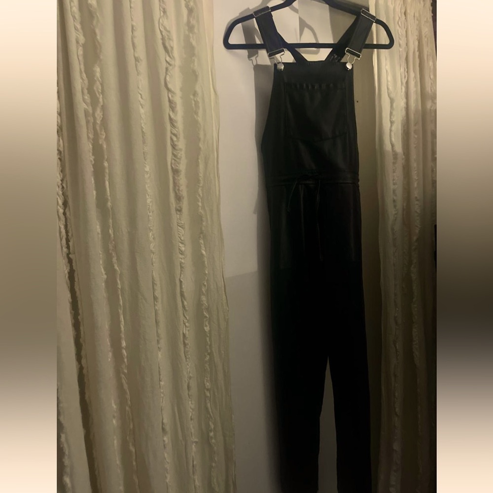 Faux leather jumpsuit with adjustable straps and zipper back